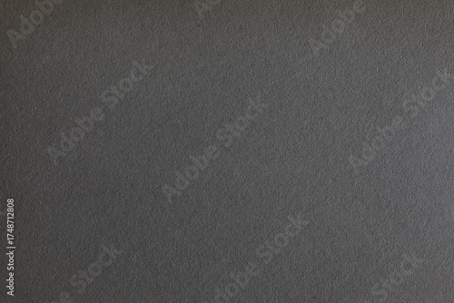 Gradient black paper texture with grains surface