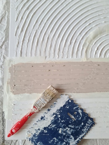 The process of making a painting from structural paste using art tools and paint brush