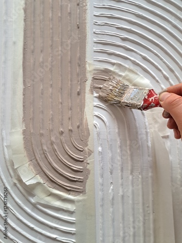 The process of making a painting from structural paste using art tools and paint brush