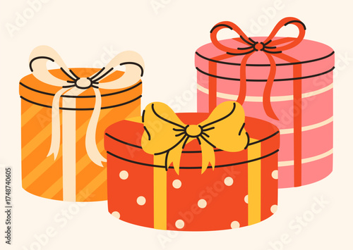 Festively wrapped round gift boxes. Elements of celebration and surprise.