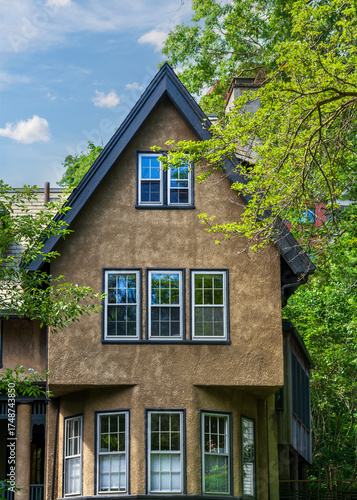 Fotografie Beautiful family home with steep gable roof and multiple windows in Brookline, M