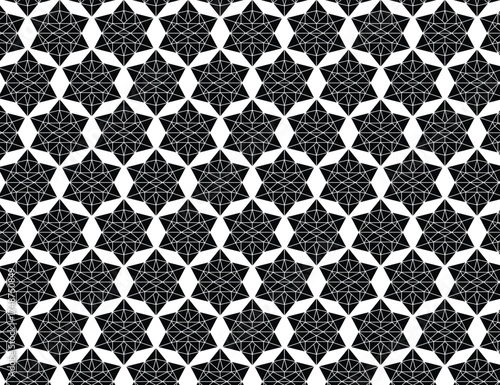 Intricate black and white geometric starburst pattern seamless texture for design backgrounds and textiles