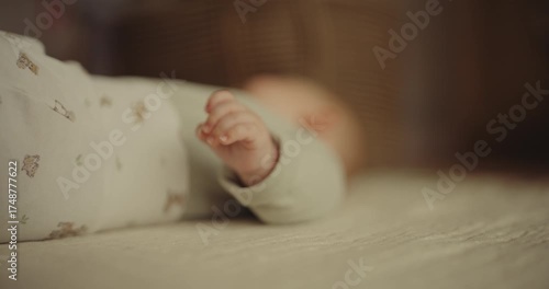 Close Detail of a Newborn's Delicate Hand on Blanket