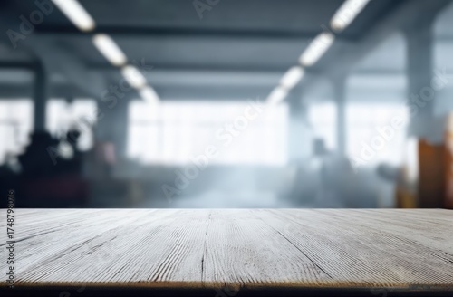 Wallpaper Mural Wooden tabletop with a rustic finish providing a surface for product display, featuring a soft focus background of an industrial setting Torontodigital.ca