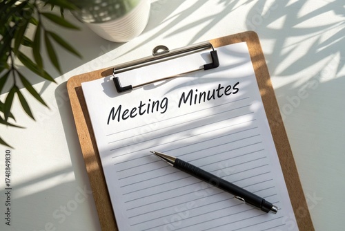 Meeting minutes recorded on a clipboard in a well-lit workspace with plants in the background