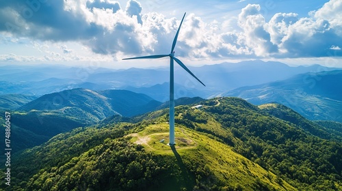 Wind Turbine on Mountain Summit: Harmonious Blend of Clean Energy and Majestic Landscape for Environmental Promotion and Energy-Themed Design