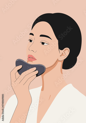 Woman doing gua sha facial massage for skincare and natural beauty routine