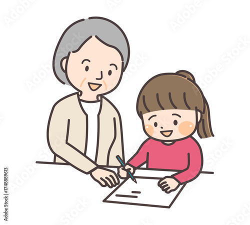 優しく孫に勉強を教えるおばあさん