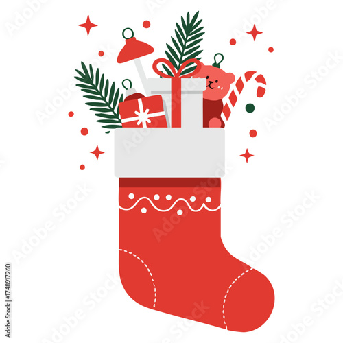 A red Christmas stocking overflows with gifts a bear a candy cane and pine branches