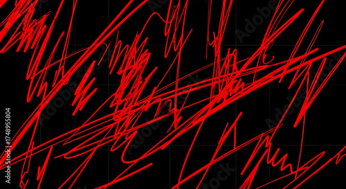 Abstract red scribbled lines on a black background creating a chaotic and energetic visual pattern.