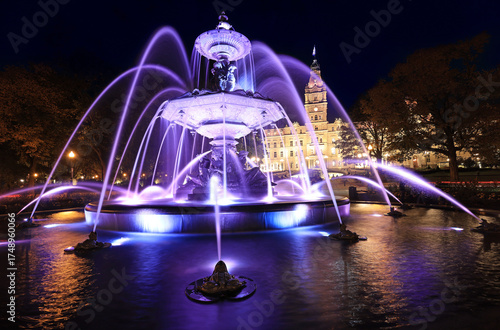 Quebec City Parliament illuminated at night with The Fontaine de Tourny on the foreground, Canada