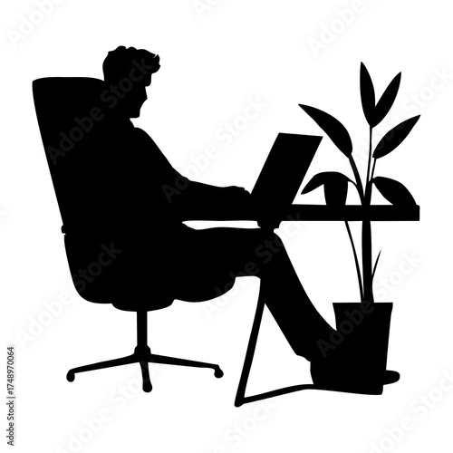 SILHOUETTE OF A MAN IN A SUIT SITTING ON A CHAIR WITH A LAPTOP ON A DESK