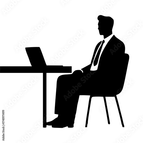 SILHOUETTE OF A MAN IN A SUIT SITTING ON A CHAIR WITH A LAPTOP ON A DESK
