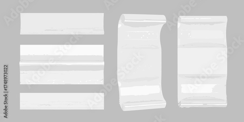 Collection of blank white paper receipts and rolled paper documents against a gray background