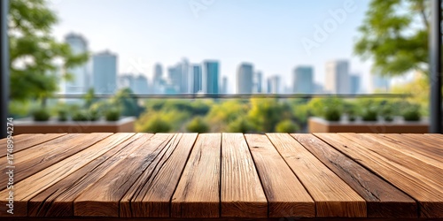 Wooden Table with Scenic City View Against Blurred Urban Skyline and Lush Green Trees in Background