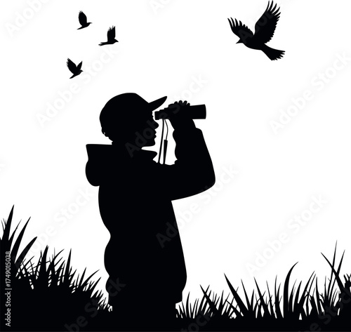 Silhouette of a person birdwatching with binoculars outdoors