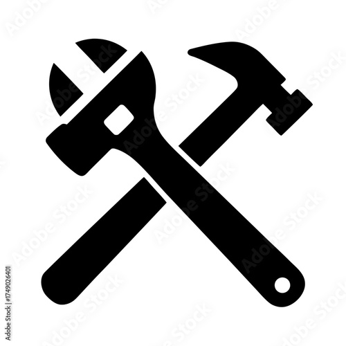 Crossed wrench and hammer tools silhouette