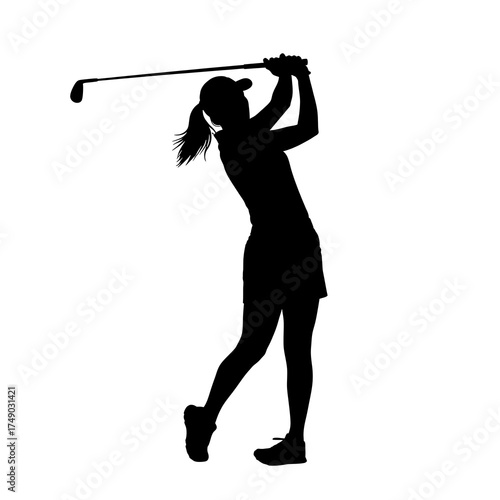 Silhouette of a female golfer swinging her club with focus.