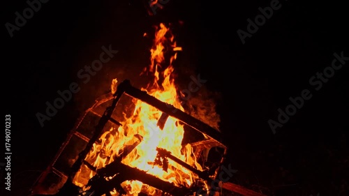 Captivating Flames of a Wood Fire Burning Bright Against Darkness