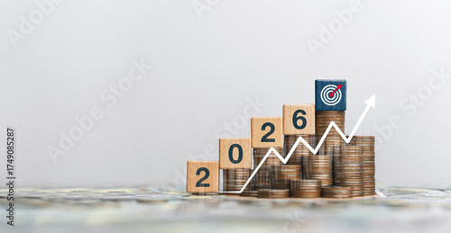 New Year 2026 concept. Beginning of success. Business investment goals for the coming year. Planning, investing and innovation. 2026 text on wooden block with icons. Goals.