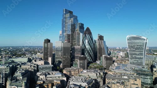 Ultra-HD aerial wide video of London Financial District skyline: Gherkin, Walkie-Talkie, Cheesegrater glinting under sharp daylight, River Thames, deep focus, modern architectural grandeur concept
