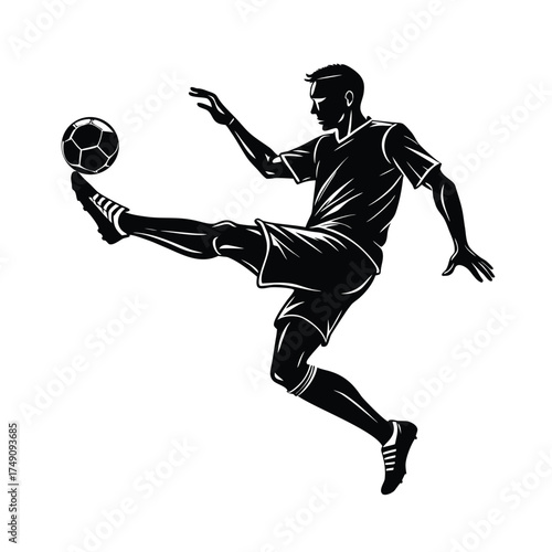 Silhouette of a soccer player juggling a ball with his foot