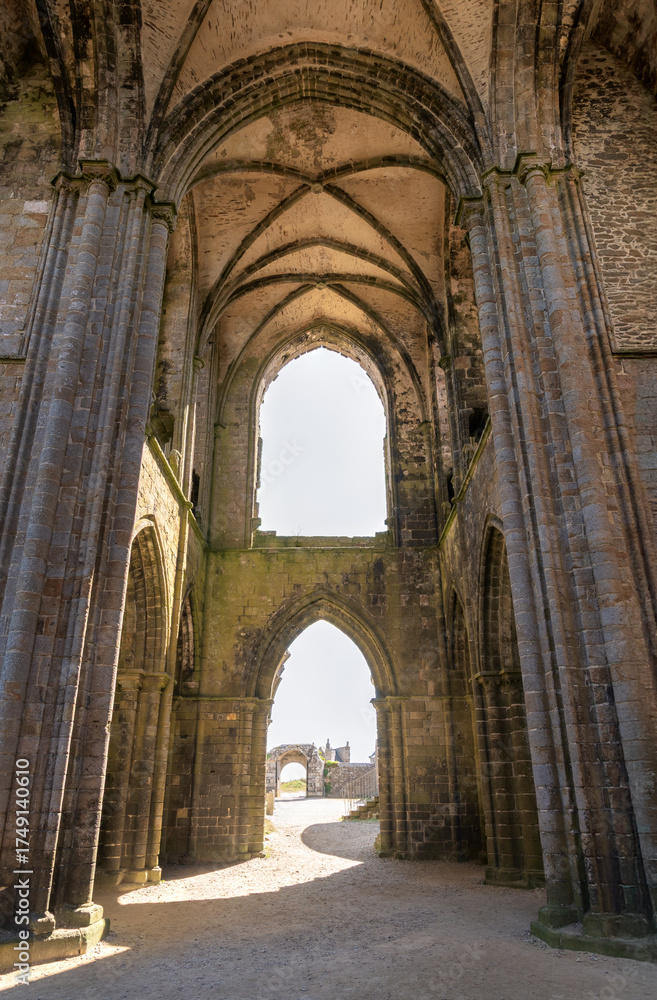 Fototapeta premium The abbey of Saint-Mathieu de Fine-Terre in Brittany, France. Ancient gothic ruin interior with arched vaults, stone columns, and open courtyard view