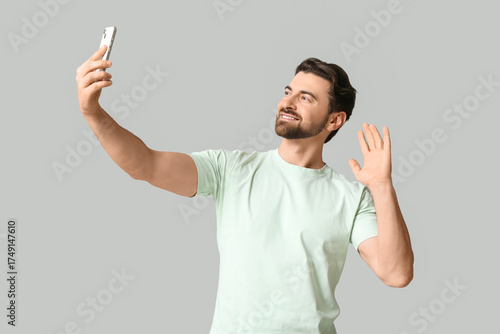 Young man with mobile phone...