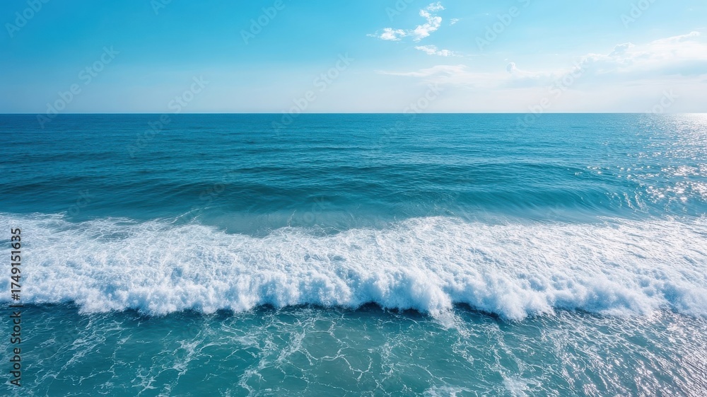 Fototapeta premium Aerial view of calm ocean, deep blue water perfect for a relaxing experience.