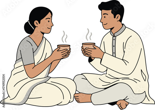 Happy South Asian Couple in Traditional Clothes Sitting and Enjoying a Romantic Tea Date