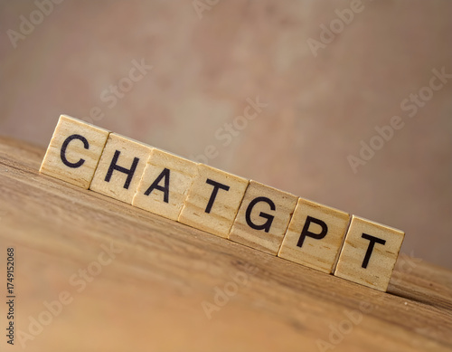 Wooden blocks spelling the word “ChatGPT” on a wooden desk, representing modern business innovation, digital transformation, and AI-driven communication in the workplace.