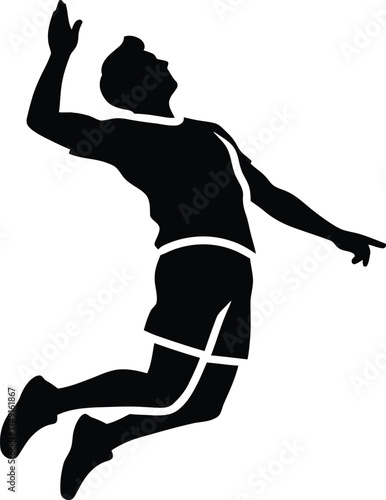 Silhouette of a volleyball player spiking the ball in mid air