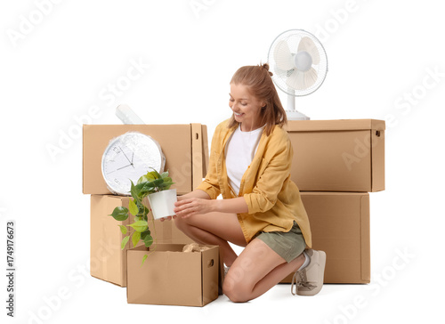 Young woman unpacking movin...