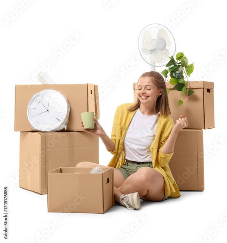 Young woman unpacking movin...