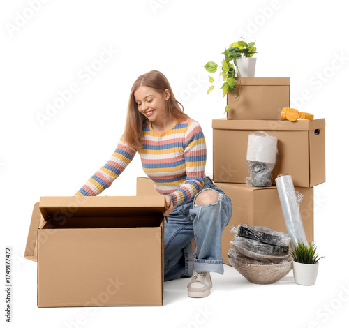 Young woman with moving box...