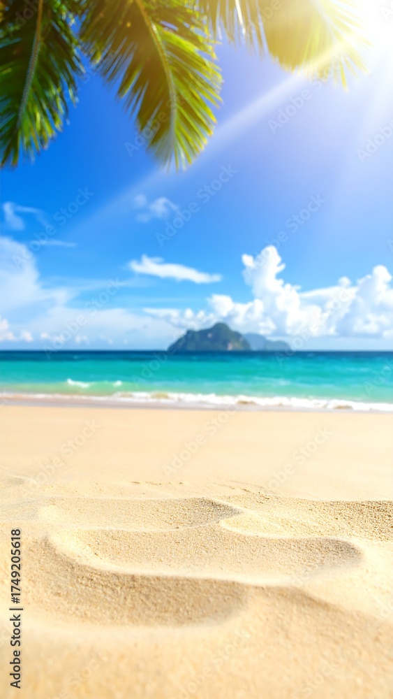 Fototapeta premium Sandy beach scene under a bright sun with palm leaves