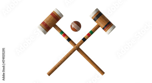 Obraz na płótnie Isolated shot of croquet mallets crossed with striped ball, ready for summer gam