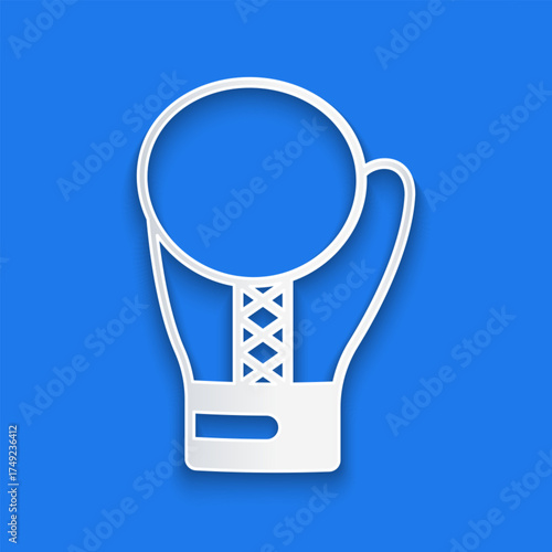 Paper cut Boxing glove icon isolated on blue background. Paper art style. Vector