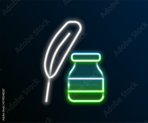 Glowing neon line Feather and inkwell icon isolated on black background. Colorful outline concept. Vector