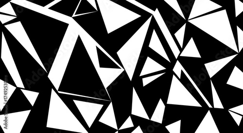 Abstract geometric pattern of white and black triangles scattered across the frame, creating a dynamic and chaotic visual effect.
