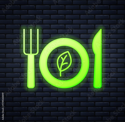 Glowing neon Vegan food diet icon isolated on brick wall background. Organic, bio, eco symbol. Vegan, no meat, lactose free, healthy, fresh and nonviolent food. Vector