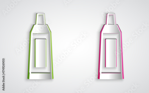 Paper cut Tube with paint palette icon isolated on grey background. Paper art style. Vector