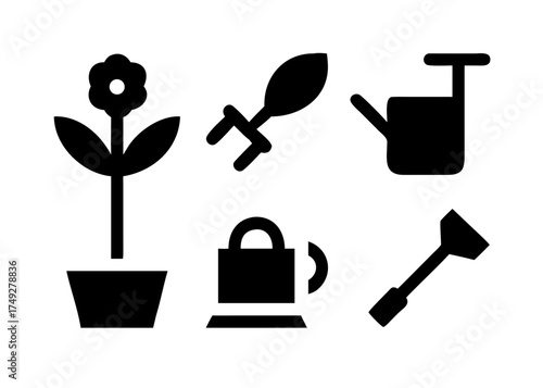 Gardening tools and flower in pot for garden care