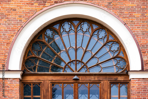 Wallpaper Mural A grand arched window with decorative wooden frame. Front view, background photo Torontodigital.ca
