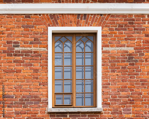 Wallpaper Mural A close-up view of a weathered red brick exterior featuring a wooden-framed window Torontodigital.ca