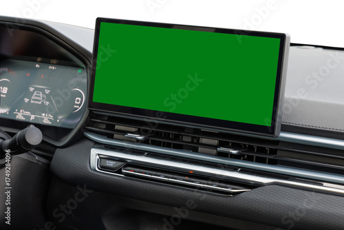 Modern car dashboard with central infotainment green screen, digital cluster and climate control buttons