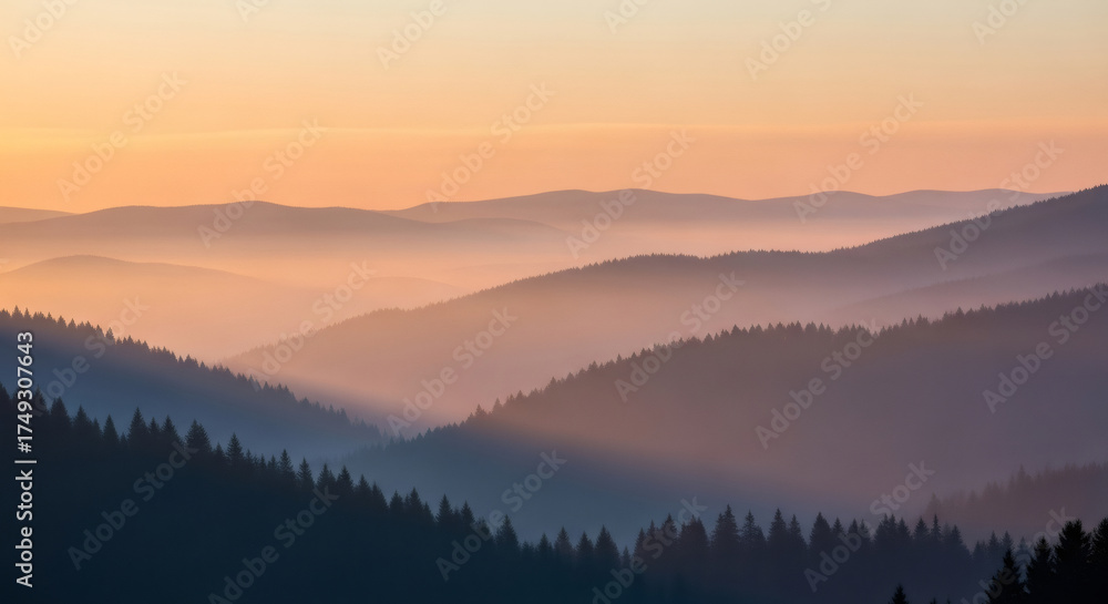 Obraz premium Breathtaking misty mountain ridges at sunrise with stunning golden light creating a peaceful, ethereal atmosphere perfect for travel and wellness brands