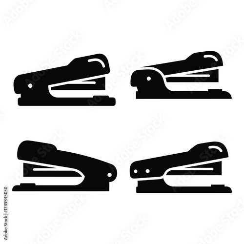 Four black silhouettes of staplers arranged in a grid displaying different angles for office and school supplies silhouette