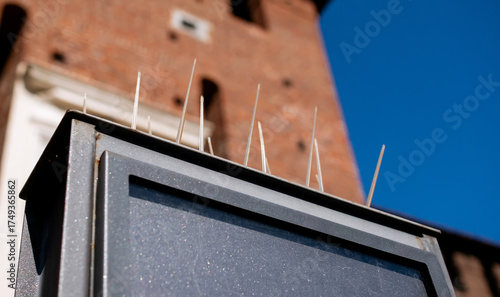 Принти на полотні Anti-bird spikes on outdoor digital display screen to prevent pigeon roosting ag