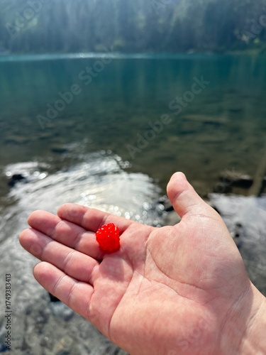 Hand holding a red heart hand hands woman fingers sand rock water summer finger body feet beach, climbing holding sea stone human concept nature